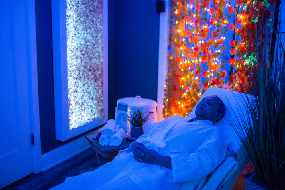 Woman laying on recliner using red light therapy at Jardin's Magical Hands in Sacramento, Ca.